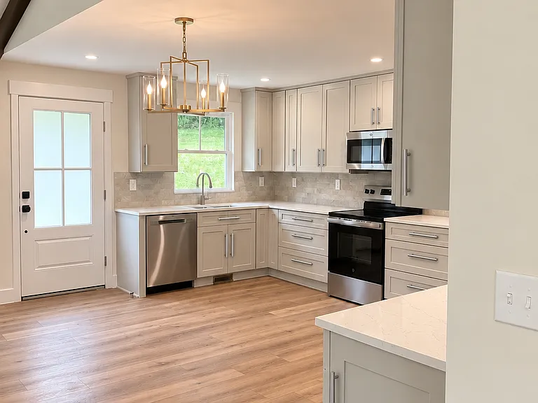 The well-appointed kitchen blends style and function with an ideal layout for both casual meals and entertaining.