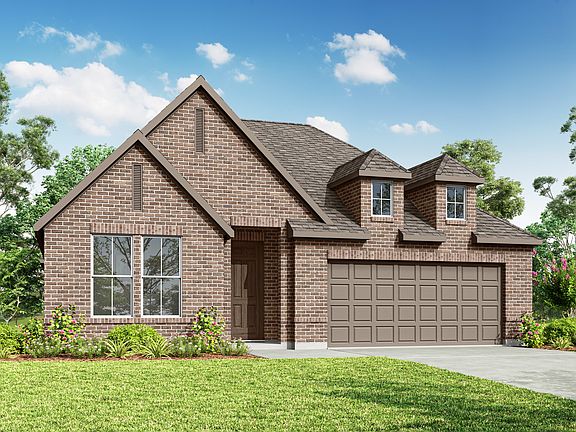 A two-story brick house with a gabled roof and a garage stands in a lush, green yard surrounded by t