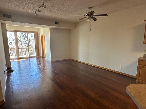 Open concept living, dining and deck space