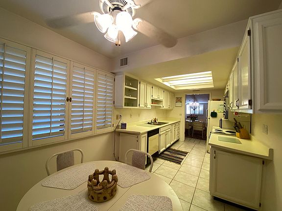 Eat-in Kitchen seats 4. Kitchen fully stocked with dishes & cookware, but lots of storage left for personal additions.