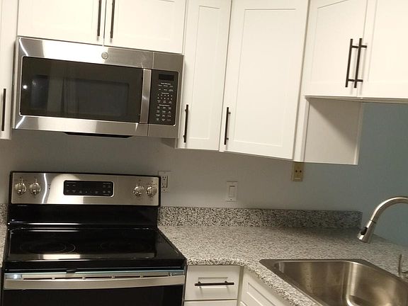 Modern door pulls added to new cabinets