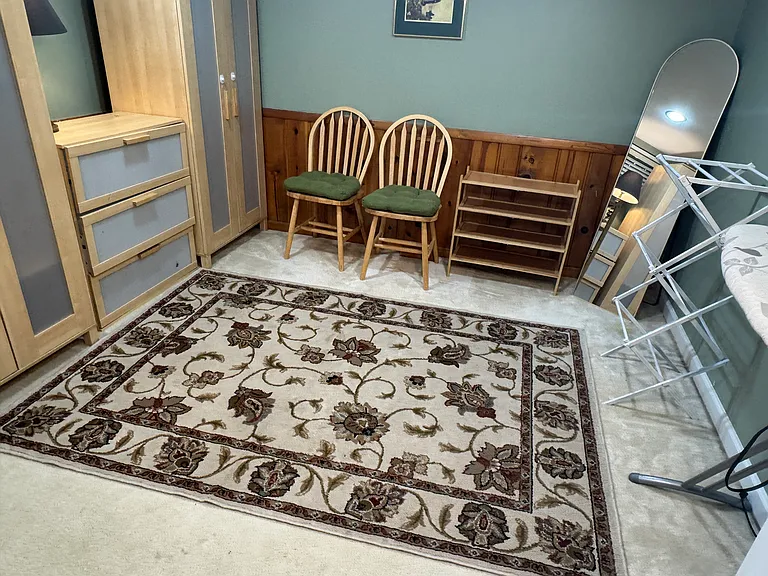 Room full of closets! Features 3 wardrobed, chest of drawers, ironing board, shoe racks, hamper and full length mirror