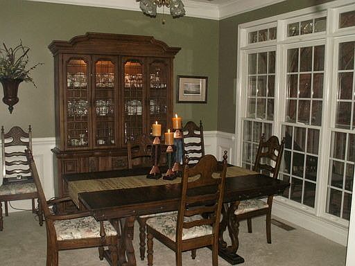 Formal Dining Room with judges paneling and crown molding