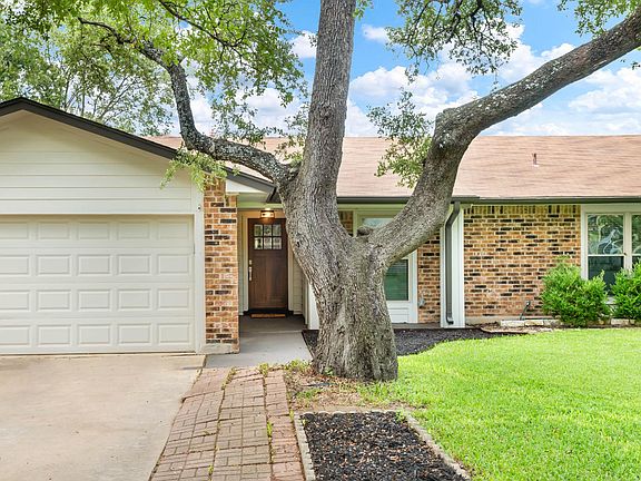 Beautiful heritage oak welcomes you into the home.