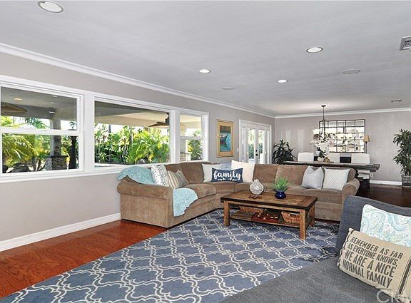 View from Family Room looking toward backyard and Dining Room. Lots of natural light from large windows & French doors.