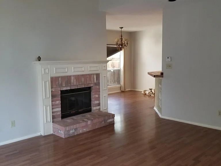 From door entrance into living room and dining area