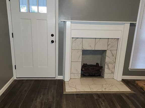 Front door and living room fireplace.