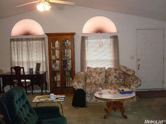 showing part of the great room concept and front entrance to home.