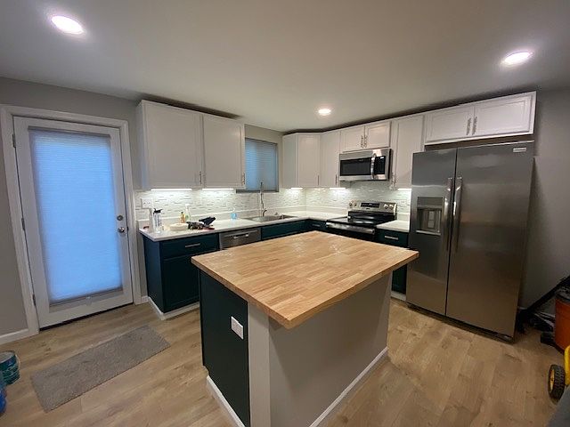Kitchen with rear glass door to patio