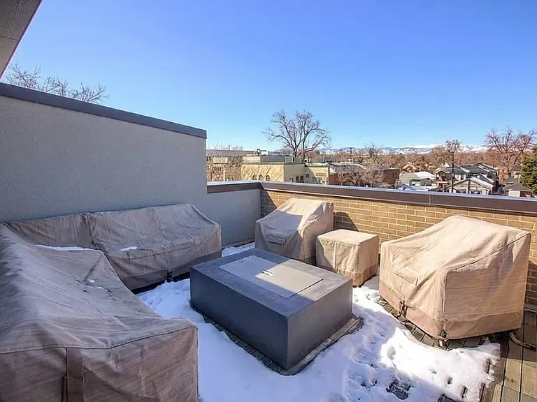 Rooftop fire pit overlooks Old South Pearl Street shops and restaurants.