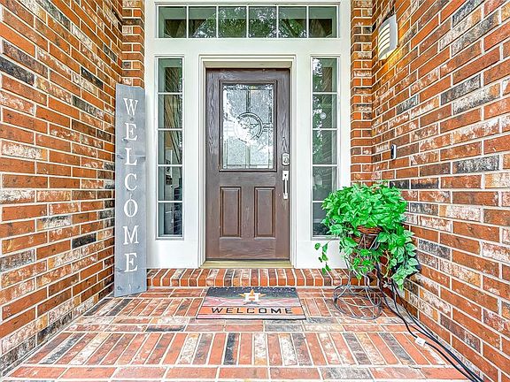 Big Texas star door and covered brick porch will welcome your friends and family