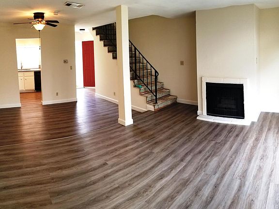 Panorama of living and dining areas downstairs