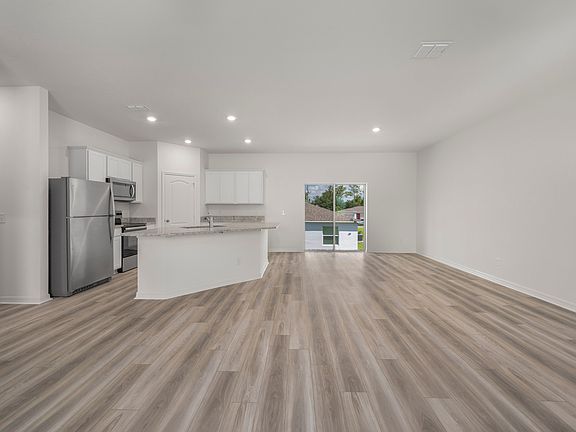 The kitchen comes chef-ready with stainless steel appliances