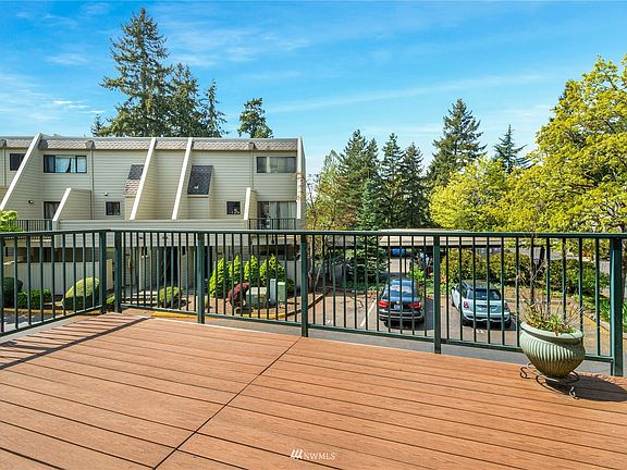 View from the deck and entrance door. Large open space for entertaining or relaxing! The unit is situated away from the street, offering more quiet than some of the other units in the complex.