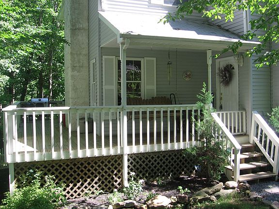 Front porch w wraparound deck
