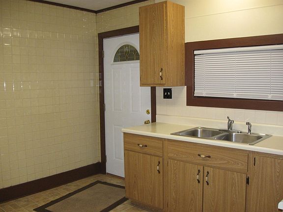 Exterior entrance to a well-lit kitchen!