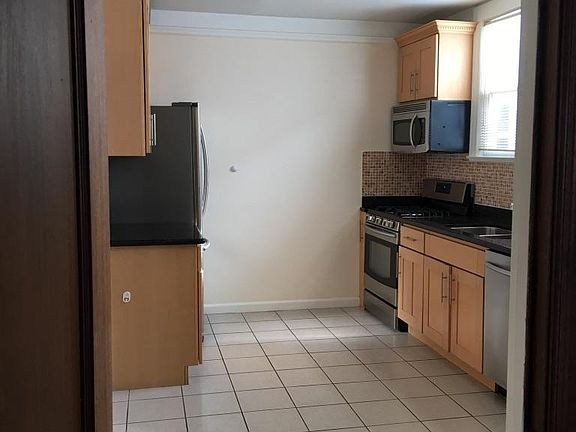 Spacious kitchen with natural light and new appliances