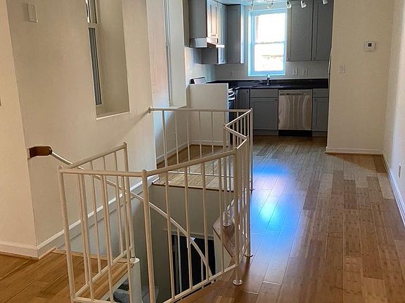Kitchen, dining area, spiral stairs down to bedroom, bath, laundry