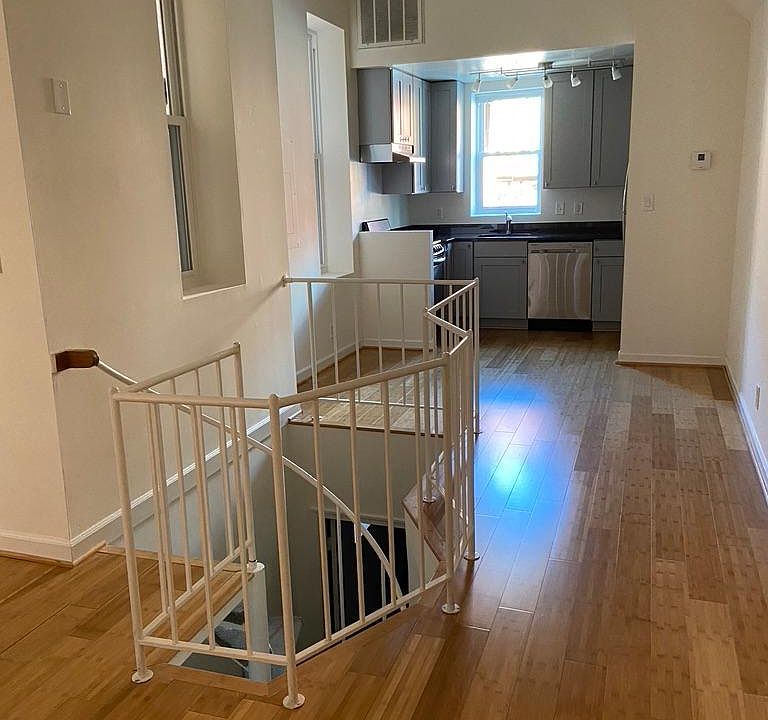 Kitchen, dining area, spiral stairs down to bedroom, bath, laundry