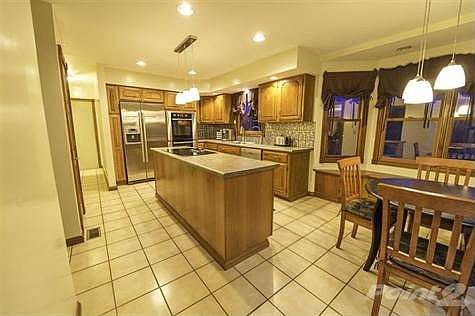 kitchen remodeled  in 2009- tile floors, stainless steel upgraded Bosh appliances- island and pantry