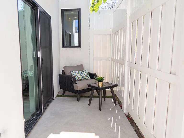 PRIVATE FENCED PATIO WITH OUTDOOR SEATING/FURNITURE