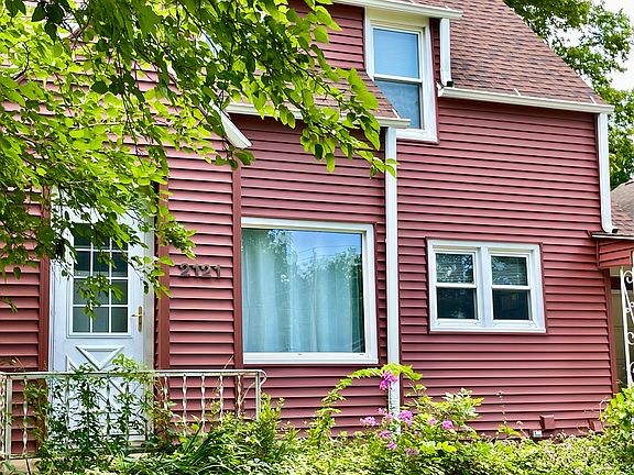 Cute, cottage-style house with carport/one car garage.