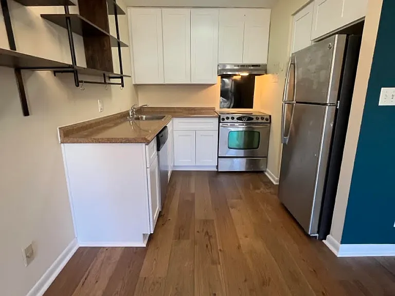 Newly remodeled kitchen with white shaker cabinets