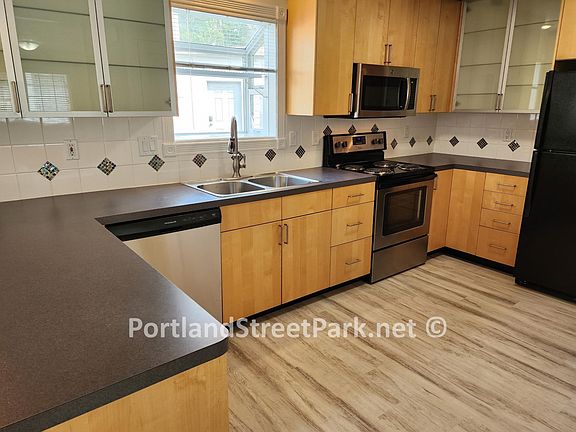 Large kitchen with ample cabinetry and counterspace