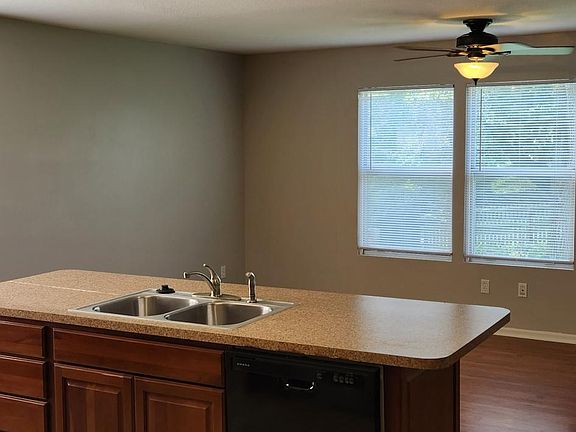 Ceiling fan, laminate flooring make the family area a great place to relax.