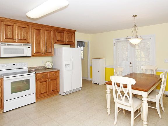 The screened porch is easily accessed through the French doors. 