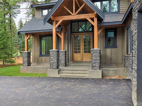 Amazing front doors. Beautiful front porch. You gotta see the back porch!!