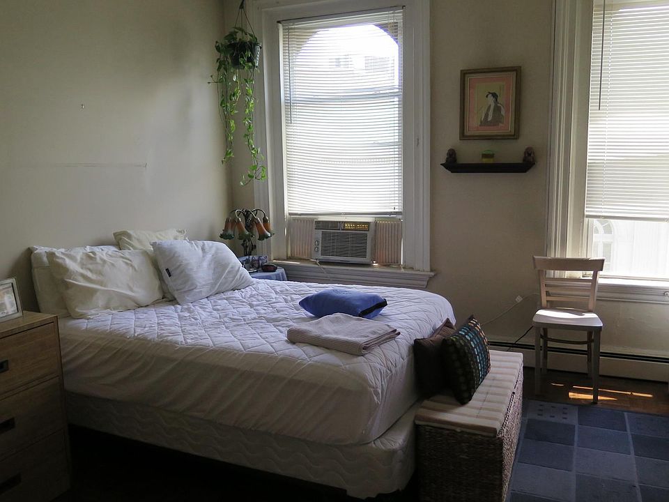 Bedroom spacious enough for a queen bed, dresser, nightstands and seating