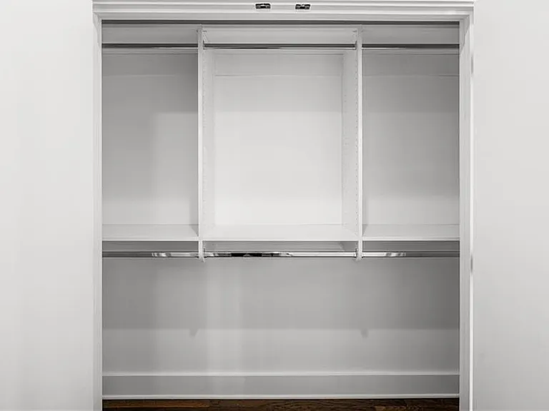 Main Bedroom Closet 1 (Note: Actual unit has light wooden floors and upgraded fixtures / appliances)