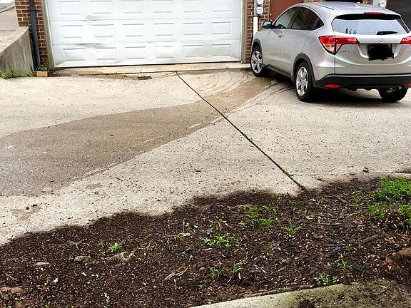 garage with additional spot outside