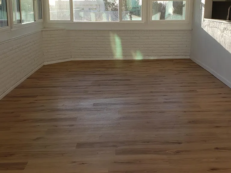 Sunroom, perspective from backdoor leading to wood deck patio