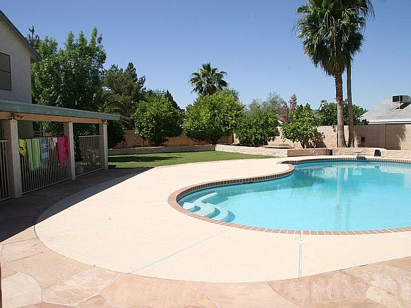 Southwest facing.  Entire patio is covered the length of the house.
