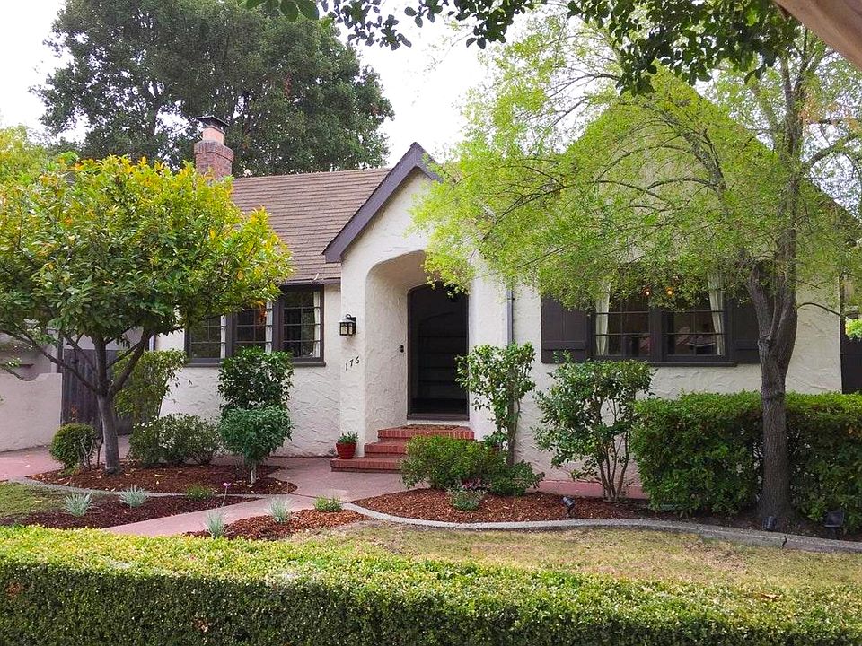 Gorgeous tudor-style home on tree-lined street in Stafford Park neighborhood.