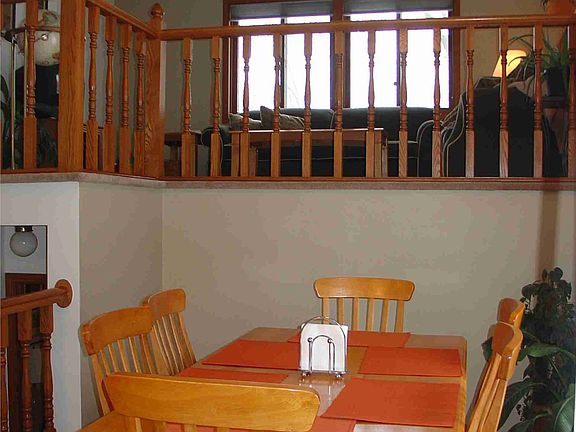 Vaulted informal dining room w/ slider to patio!  Hardwood floors!