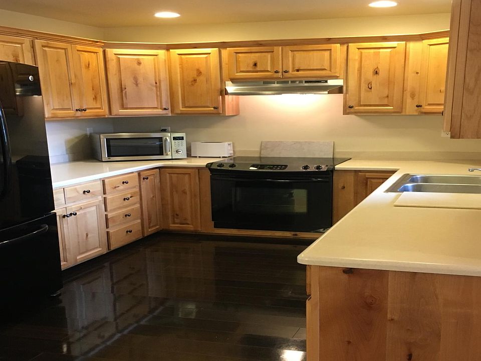 Kitchen includes dishwasher, refrigerator, stove, oven and microwave oven.