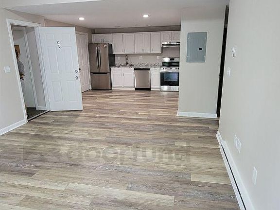 Open floorplan with large living room into kitchen