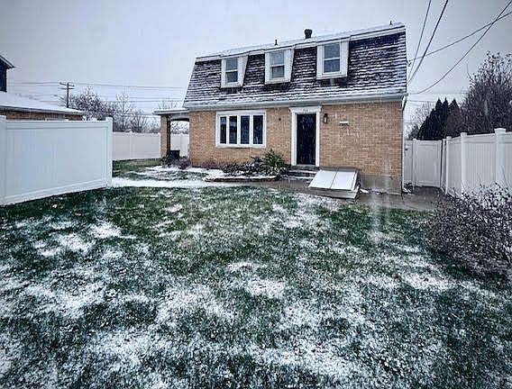 Generous backyard with privacy fence.