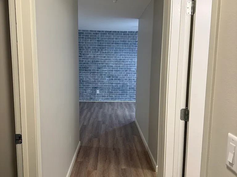 Hallway From Bedrooms & Bathrooms Looking Towards The Kitchen and Living Room
