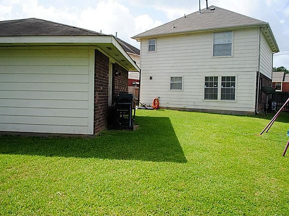 The backyard with a detached garage.