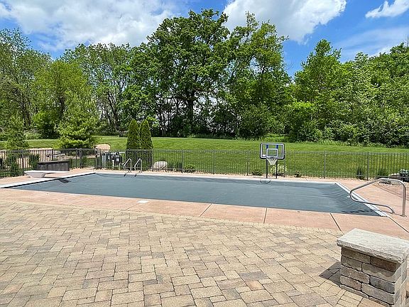 Automatic locking pool cover