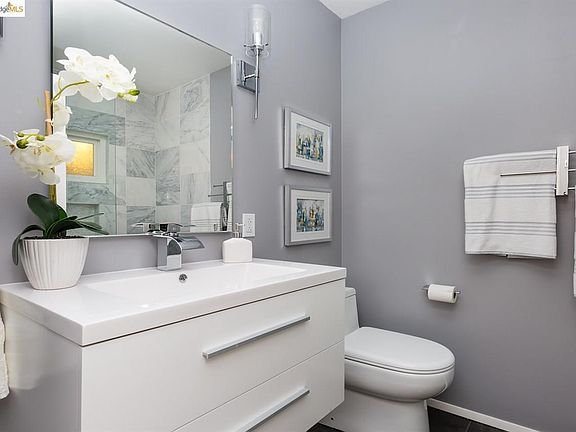 Updated bathroom with newly added teak medicine cabinet.