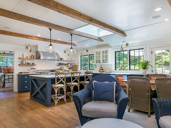 HUGE chef's kitchen is an entertainer's DREAM! This kitchen features a 48" professional-grade Viking 6-burner stove with stove-top grill and 2 ovens, a Sub-Zero fridge, 2 Bosch dishwashers, 2 porcelain farmhouse sinks and 4 under-counter garbage and recy