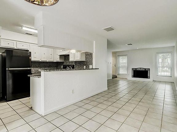 View of kitchen and dining/living area