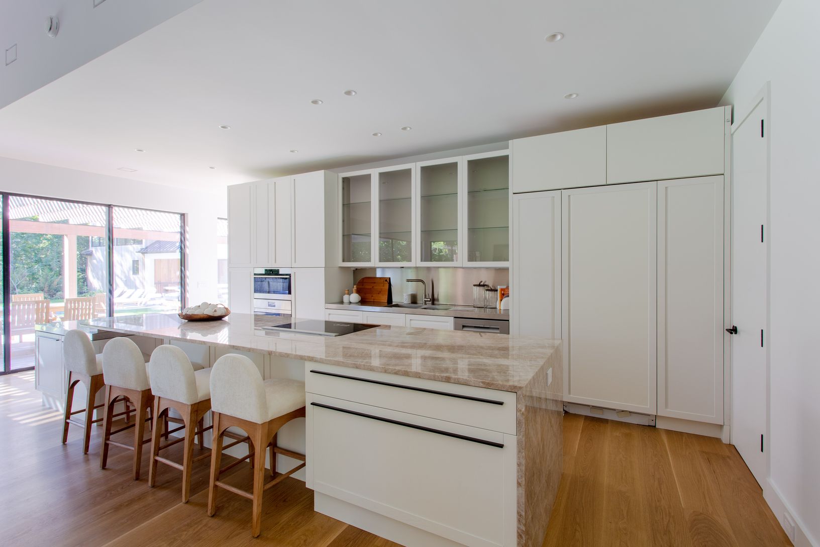  Custom cabinets made in Italy, huge kitchen island with granite top and stainless steel accents 