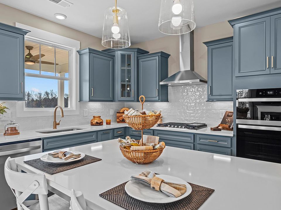 Stunning blue cabinetry kitchen at Mulberry Estates by DRB Homes in Simpsonville, South Carolina