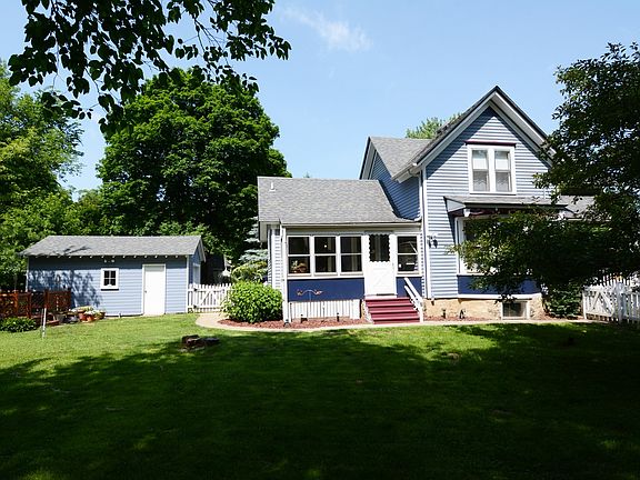 3 Season porch overlooking beautiful fenced yard.